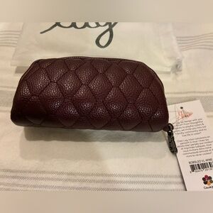 NWT Bobsled Vegan leather in color: wine